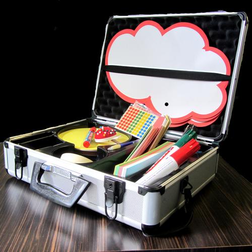 A metal presentation case with filing cards, pens, stickers and pins.