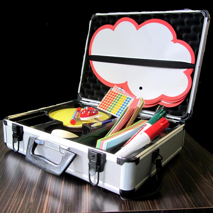 A metal presentation case with filing cards, pens, stickers and pins.